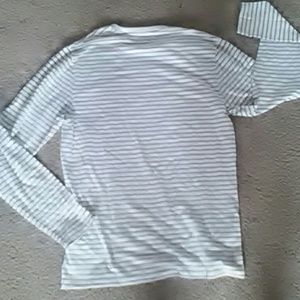 A white and gery striped sweatshirt